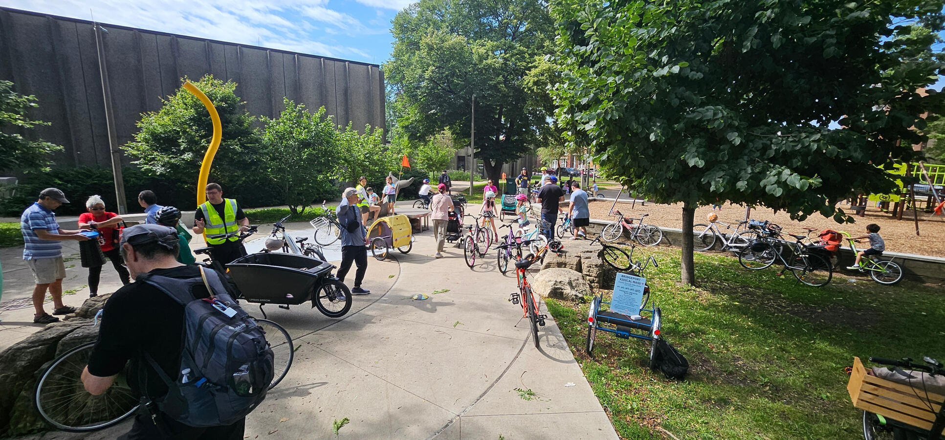 Untitled Several dozen bicycles and cyclists of mixed age in McGuane Park
